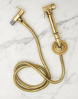 brass bridge faucet on a black marble background
