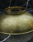 Decorative Bronze drop in sink on a black marble surface