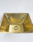 Brass sink on a white background