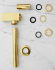 Solid Brass Bathroom Sink P-Trap mounted on a white wall