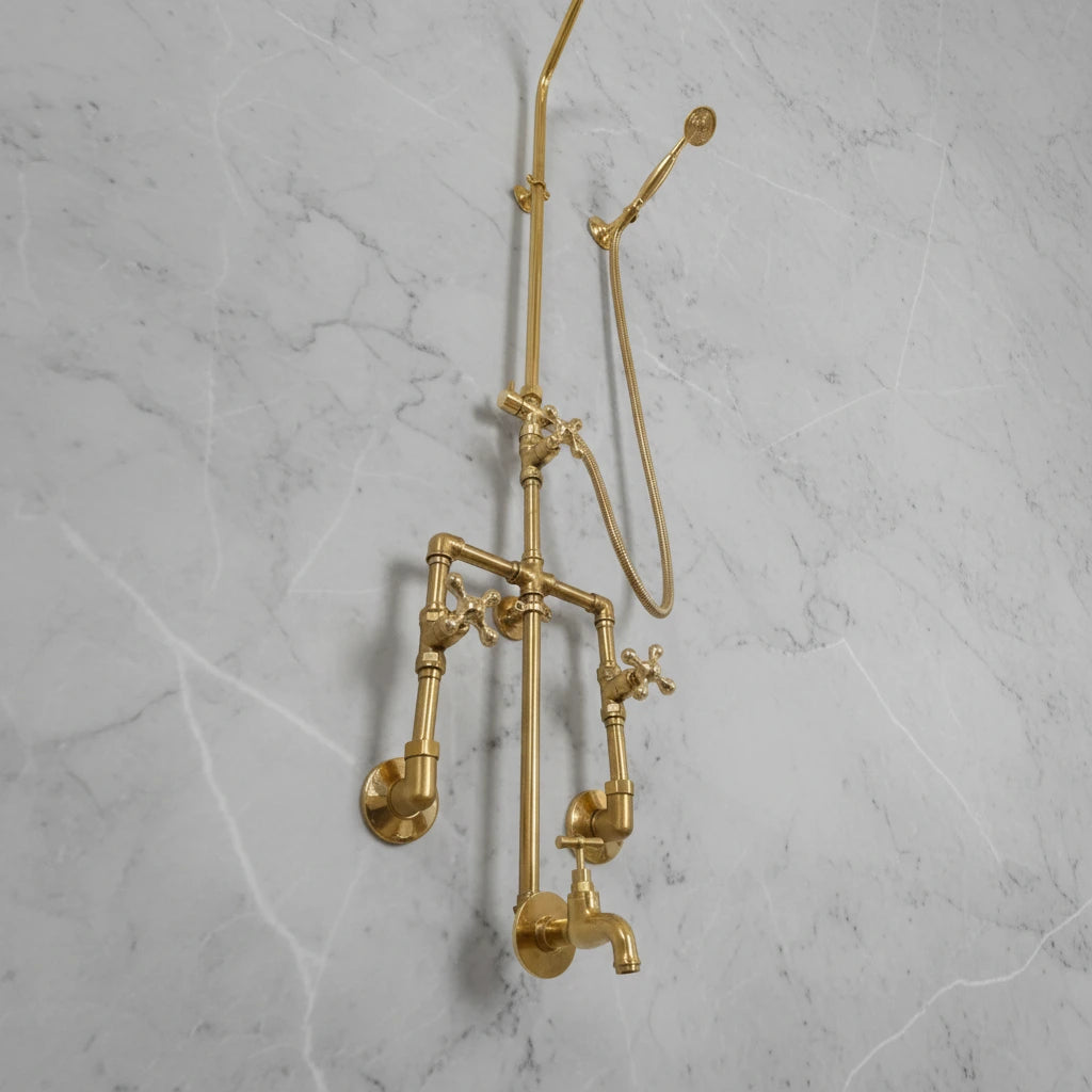 Brass shower system mounted on a gray marble wall