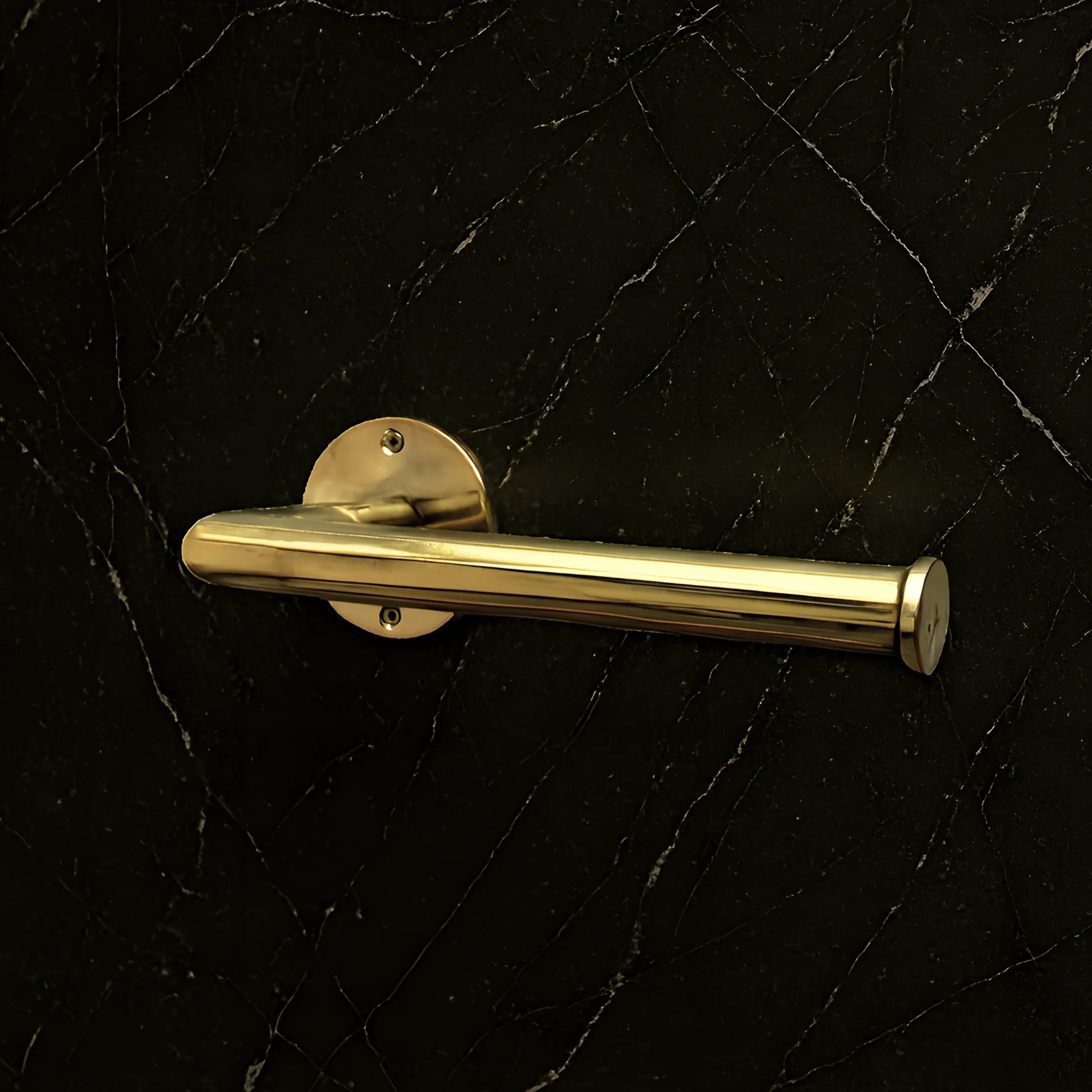 Brass Toilet paper holder on a black marble