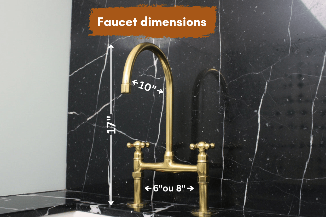 brass bridge faucet on a black marble background