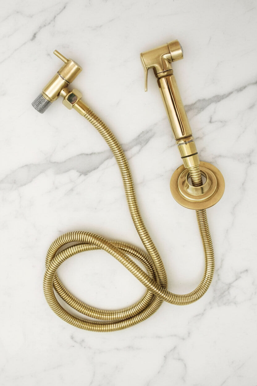 brass bridge faucet on a black marble background