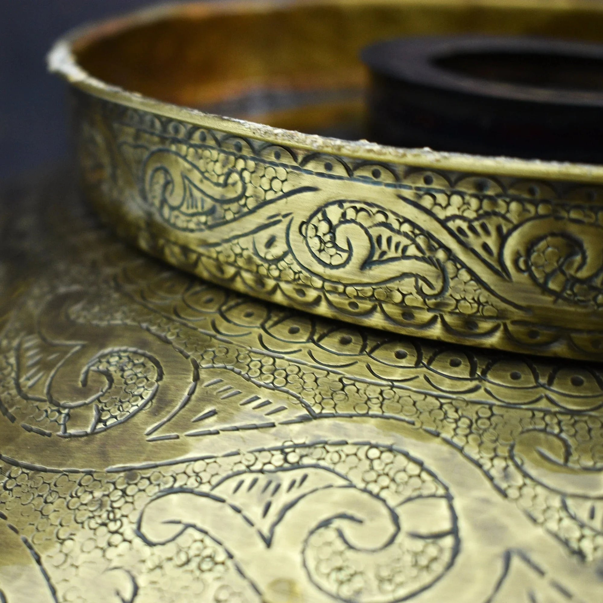 Close-up of a Bronze drop in sink with intricate patterns