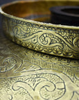 Close-up of a Bronze drop in sink with intricate patterns