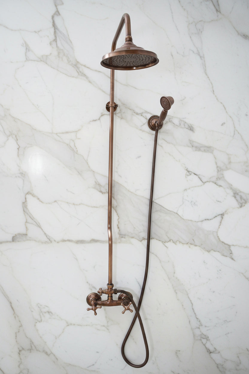 Vintage-style shower head and hose on a light blue background