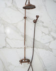 Vintage-style shower head and hose on a light blue background