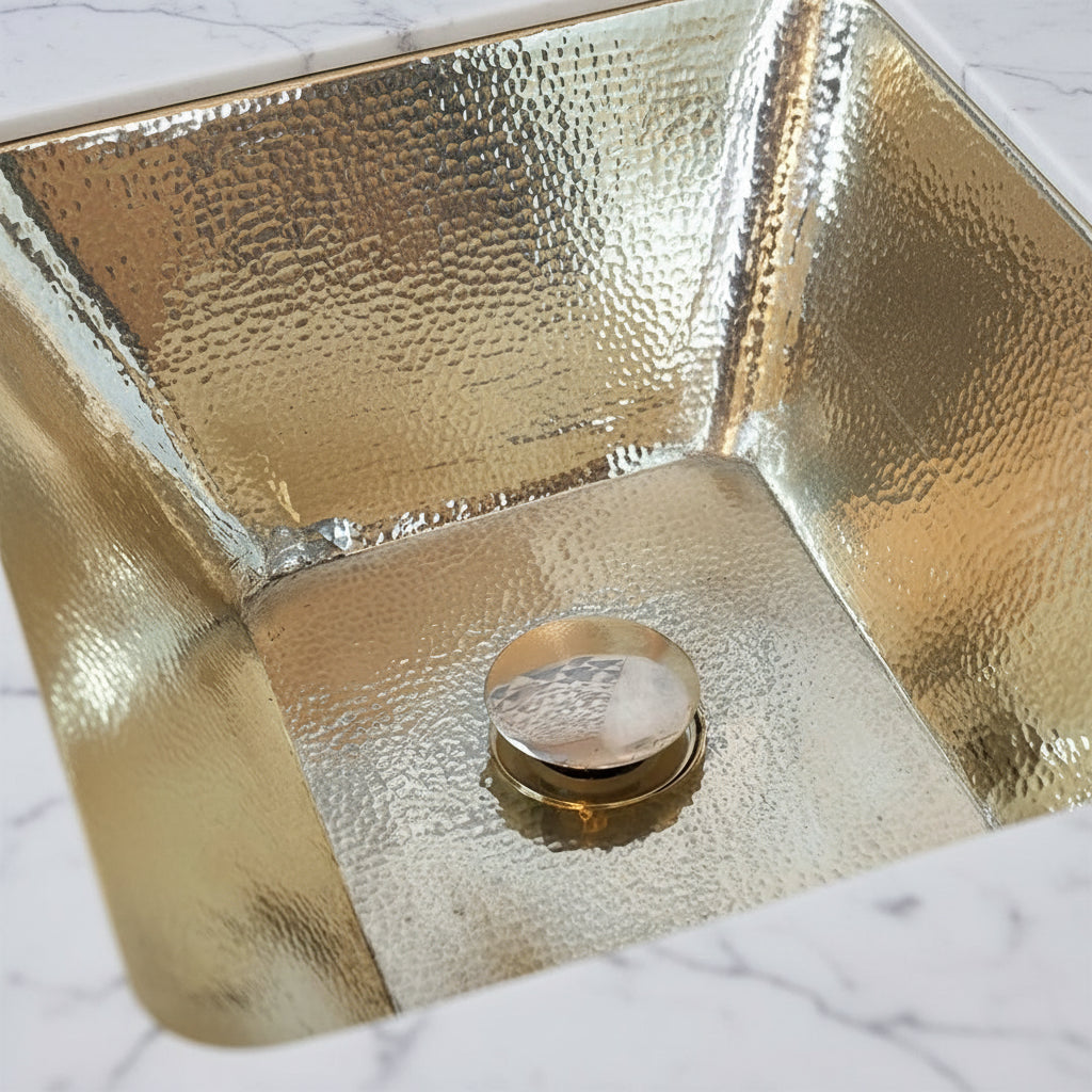Close-up of a brass hammered sink