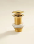 Solid Brass Bathroom Sink P-Trap mounted on a white wall 