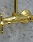 brass shower faucet on a white background
