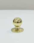 Gold spherical object on a white background