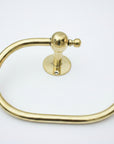 Gold towel ring on a gray surface