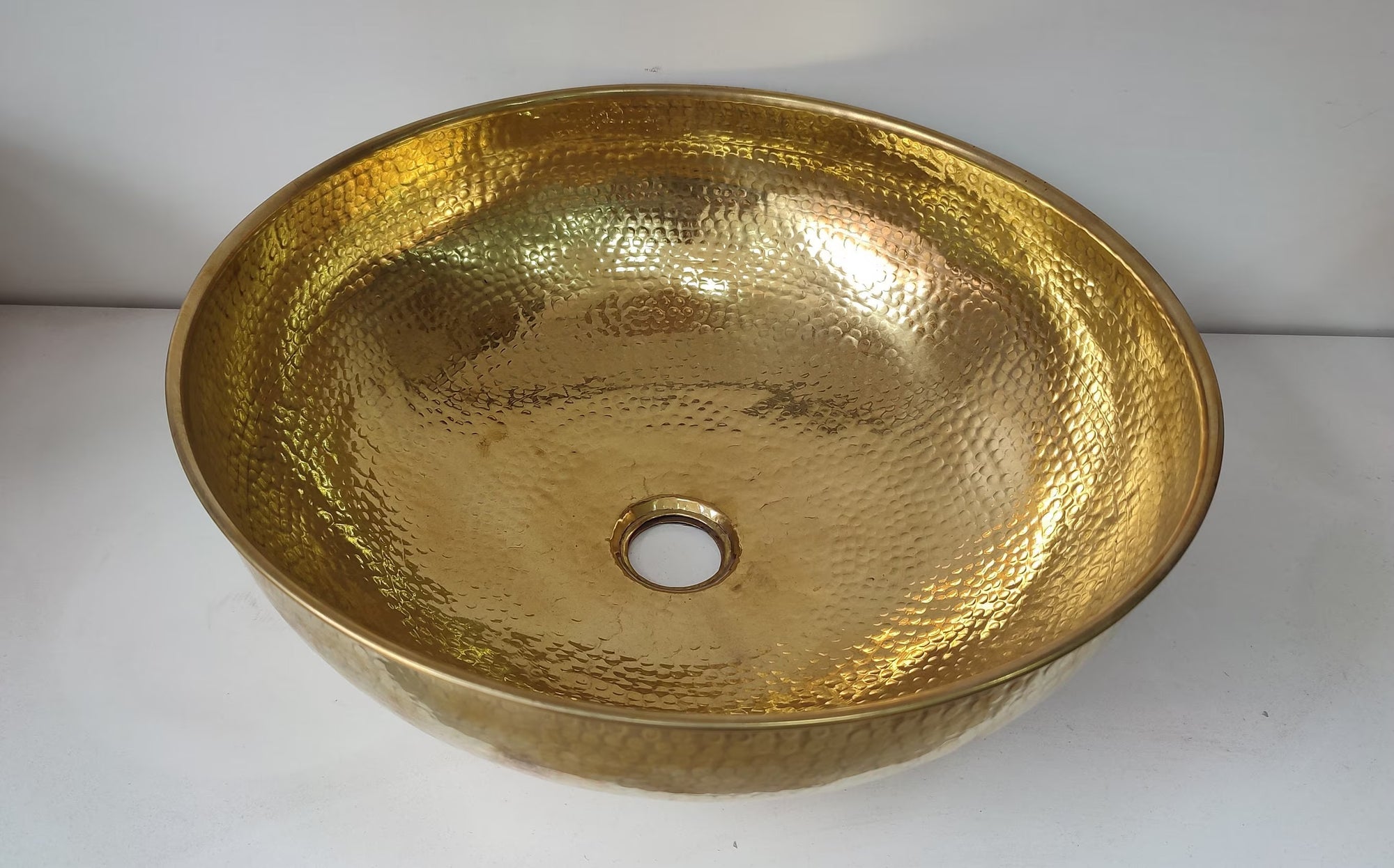 handmade Brass Vessel Sink on a white background