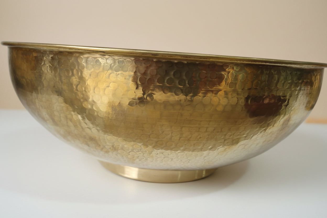 handmade Brass Vessel Sink with a textured surface on a white background