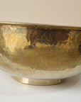 handmade Brass Vessel Sink with a textured surface on a white background